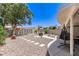 Serene backyard oasis with rock ground cover, patio, and shade trees at 7736 E Rancho Vista Dr, Scottsdale, AZ 85251