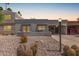 Charming single-story home with desert landscaping, covered parking, and a welcoming front patio at 7736 E Rancho Vista Dr, Scottsdale, AZ 85251