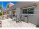 Relaxing front porch with chairs and table, perfect for enjoying the outdoors at 7736 E Rancho Vista Dr, Scottsdale, AZ 85251