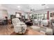 Bright and airy living room with hardwood floors, comfortable seating, and sliding glass doors at 7736 E Rancho Vista Dr, Scottsdale, AZ 85251