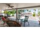 Cozy outdoor patio area featuring a seating area with various chairs, decoratives, and a ceiling fan at 7736 E Rancho Vista Dr, Scottsdale, AZ 85251