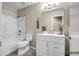 Clean bathroom featuring a white vanity, toilet, and bathtub with tiled shower at 8178 W Tonopah Dr, Peoria, AZ 85382