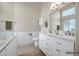 Elegant bathroom with double vanity, quartz countertops, and marble-tiled backsplash at 8178 W Tonopah Dr, Peoria, AZ 85382
