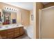 Bathroom with double sinks, vanity, soaking tub, and shower at 8259 W Carol Ave, Peoria, AZ 85345