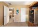 Bright bedroom with neutral walls and carpet; features white closets and interior doors at 8259 W Carol Ave, Peoria, AZ 85345
