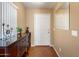 Welcoming entryway featuring hardwood floors, a console table, and a mirror at 8259 W Carol Ave, Peoria, AZ 85345