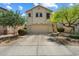 Charming two-story home with desert landscaping and a spacious driveway at 8259 W Carol Ave, Peoria, AZ 85345