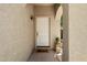 Inviting front entrance with a welcome mat and decorative plant at 8259 W Carol Ave, Peoria, AZ 85345