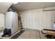 Spacious garage features lots of storage cabinets and a full-size refrigerator at 8259 W Carol Ave, Peoria, AZ 85345