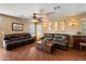 Inviting living room with two leather sofas and hardwood floors at 8259 W Carol Ave, Peoria, AZ 85345