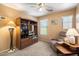 Comfortable living room with a built-in shelving unit and natural light at 8259 W Carol Ave, Peoria, AZ 85345