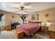 Spacious bedroom with ample natural light, wood furnishings, and a cozy atmosphere at 8259 W Carol Ave, Peoria, AZ 85345