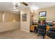 Cozy home office space with multiple monitors, a comfortable chair, and ample lighting at 8259 W Carol Ave, Peoria, AZ 85345