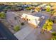 Aerial view of a desert home with a private driveway, landscaping, and neighborhood at 8351 S Summit Dr, Casa Grande, AZ 85193