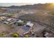 Desert home with expansive fenced yard, outbuildings, surrounded by desert landscaping and mountain views at 8351 S Summit Dr, Casa Grande, AZ 85193