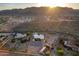 Desert home with expansive fenced yard, outbuildings, surrounded by desert landscaping and mountain views at 8351 S Summit Dr, Casa Grande, AZ 85193