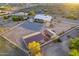 Expansive desert property featuring a ranch home, generous outdoor space, storage sheds, and a white-fenced boundary at 8351 S Summit Dr, Casa Grande, AZ 85193