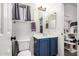 Cozy bathroom featuring updated vanity, tile floors, and a cat tree for the feline lovers at 8351 S Summit Dr, Casa Grande, AZ 85193