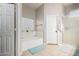 Bright bathroom featuring a soaking tub, a walk-in shower, and neutral tile flooring at 8351 S Summit Dr, Casa Grande, AZ 85193