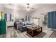 Comfortable bedroom with a ceiling fan, a sitting area, and a sliding glass door at 8351 S Summit Dr, Casa Grande, AZ 85193