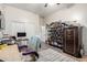 Bedroom with safe, shelving, desk, and dual door closet, showcasing versatile storage at 8351 S Summit Dr, Casa Grande, AZ 85193