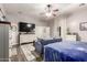 Bedroom featuring wood floors, a ceiling fan, and a comfortable sitting area at 8351 S Summit Dr, Casa Grande, AZ 85193