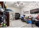 Eclectic bedroom features a cat tree, tv, floral wallpaper, desk, and modern flooring at 8351 S Summit Dr, Casa Grande, AZ 85193