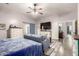Bedroom featuring wood floors, a ceiling fan, and a comfortable sitting area at 8351 S Summit Dr, Casa Grande, AZ 85193
