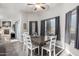 Inviting dining area with natural light, stylish table set, and a view to the fireplace at 8351 S Summit Dr, Casa Grande, AZ 85193