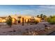 Inviting single-story home featuring a well-manicured front yard and neutral-toned exterior at 8351 S Summit Dr, Casa Grande, AZ 85193