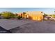 Charming home showcasing an expansive driveway leading to a spacious two-car garage at 8351 S Summit Dr, Casa Grande, AZ 85193