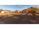 Desert home with a large yard, featuring outbuildings, providing ample space and storage at 8351 S Summit Dr, Casa Grande, AZ 85193