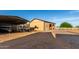 Spacious metal garage/workshop with gravel drive, offering ample storage and workspace at 8351 S Summit Dr, Casa Grande, AZ 85193