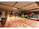 Spacious garage with ample storage, red concrete floor, and lighting at 8351 S Summit Dr, Casa Grande, AZ 85193