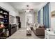Comfortable living room featuring a plush sectional, ceiling fan, and neutral decor at 8351 S Summit Dr, Casa Grande, AZ 85193