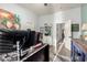 Office area with view of hallway, white walls, wood-look flooring, and blue accents at 8351 S Summit Dr, Casa Grande, AZ 85193