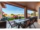 Covered patio with outdoor seating area and a view of the backyard playground at 8351 S Summit Dr, Casa Grande, AZ 85193