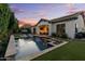 Inviting backyard with a sparkling pool, hot tub and outdoor seating area perfect for relaxing and entertaining at 883 E Hampton Ln, Gilbert, AZ 85295