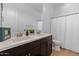 Bright bathroom featuring a double vanity and modern fixtures at 883 E Hampton Ln, Gilbert, AZ 85295
