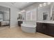 Beautiful bathroom with a soaking tub, dual vanities and walk in shower at 883 E Hampton Ln, Gilbert, AZ 85295
