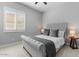 Cozy bedroom with upholstered headboard, bedside tables, and natural light at 883 E Hampton Ln, Gilbert, AZ 85295