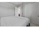 Clean bedroom boasts white walls and sliding closet doors for a tidy look at 883 E Hampton Ln, Gilbert, AZ 85295