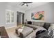 Cozy living room with a sectional sofa, window shutters and tasteful decor at 883 E Hampton Ln, Gilbert, AZ 85295