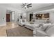 Spacious living room with open concept design and a white sectional sofa at 883 E Hampton Ln, Gilbert, AZ 85295