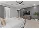 Beautiful main bedroom with barn door entry, accent wall, and plush seating at 883 E Hampton Ln, Gilbert, AZ 85295