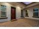 Exterior courtyard featuring brick flooring, stucco walls, and plenty of natural light at 883 E Hampton Ln, Gilbert, AZ 85295
