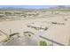 Expansive desert property with a single-story home, fenced yard, and mountain views in the distance at 8912 N Johnson Ct, Maricopa, AZ 85139