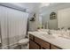 Bathroom with large mirror, white shower curtain, and plenty of counter space at 8912 N Johnson Ct, Maricopa, AZ 85139