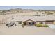 Charming single-story home featuring a well-maintained desert landscape and covered front porch at 8912 N Johnson Ct, Maricopa, AZ 85139