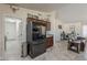 Spacious kitchen with dark cabinetry, stainless steel refrigerator, and seamless flow to other rooms at 8912 N Johnson Ct, Maricopa, AZ 85139
